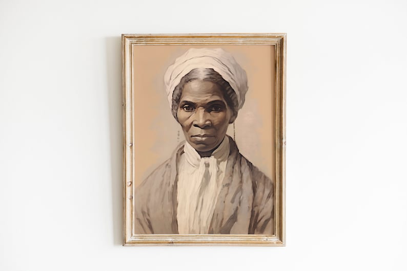 May include: A framed portrait of a woman with dark skin, wearing a white head covering and a light-colored garment. The artwork has a vintage aesthetic, with a soft color palette of beige, gray, and white. The frame is a distressed gold color.