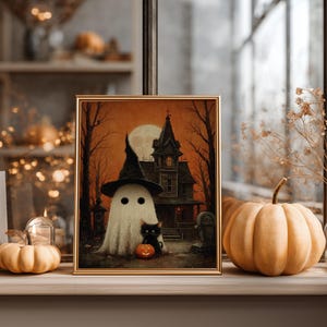 Vintage-style Halloween wall art featuring a cute ghost in a witch hat, a black cat with a glowing pumpkin, and a haunted house under a full moon. Perfect printable art for spooky and gothic Halloween decor.