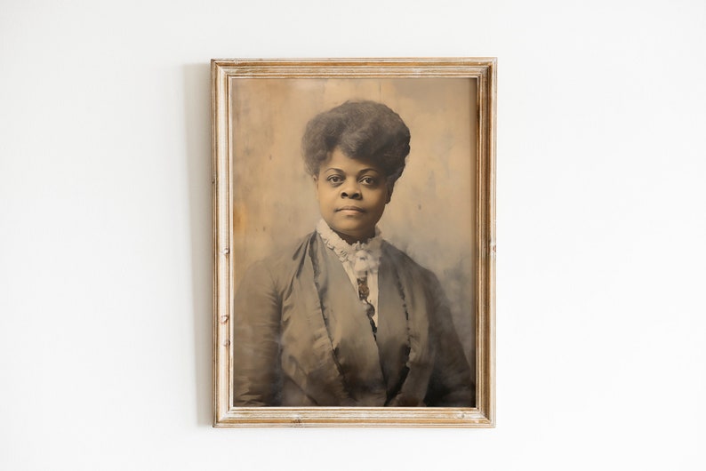 May include: Sepia-toned portrait of a woman in a vintage frame. The subject has dark hair and is wearing a dark jacket with a white lace collar. The frame is a light color with a distressed finish, adding to the antique aesthetic.