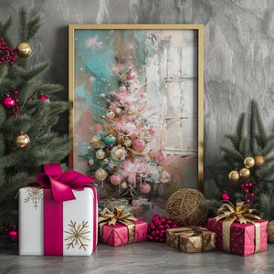 May include: A framed painting of a pink Christmas tree with gold and blue ornaments, surrounded by wrapped gifts with pink ribbons and gold snowflakes. The gifts are on a gray surface with a gold and brown ball ornament.