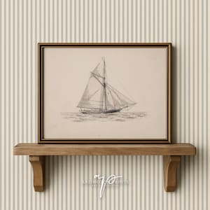 May include: Framed black and white nautical print of a sailboat with detailed rigging and sails. The artwork is displayed on a wooden shelf with decorative brackets, against a striped wallpaper background. The print is signed by "ARLINGTON PRINTS ART COLLECTIVE".