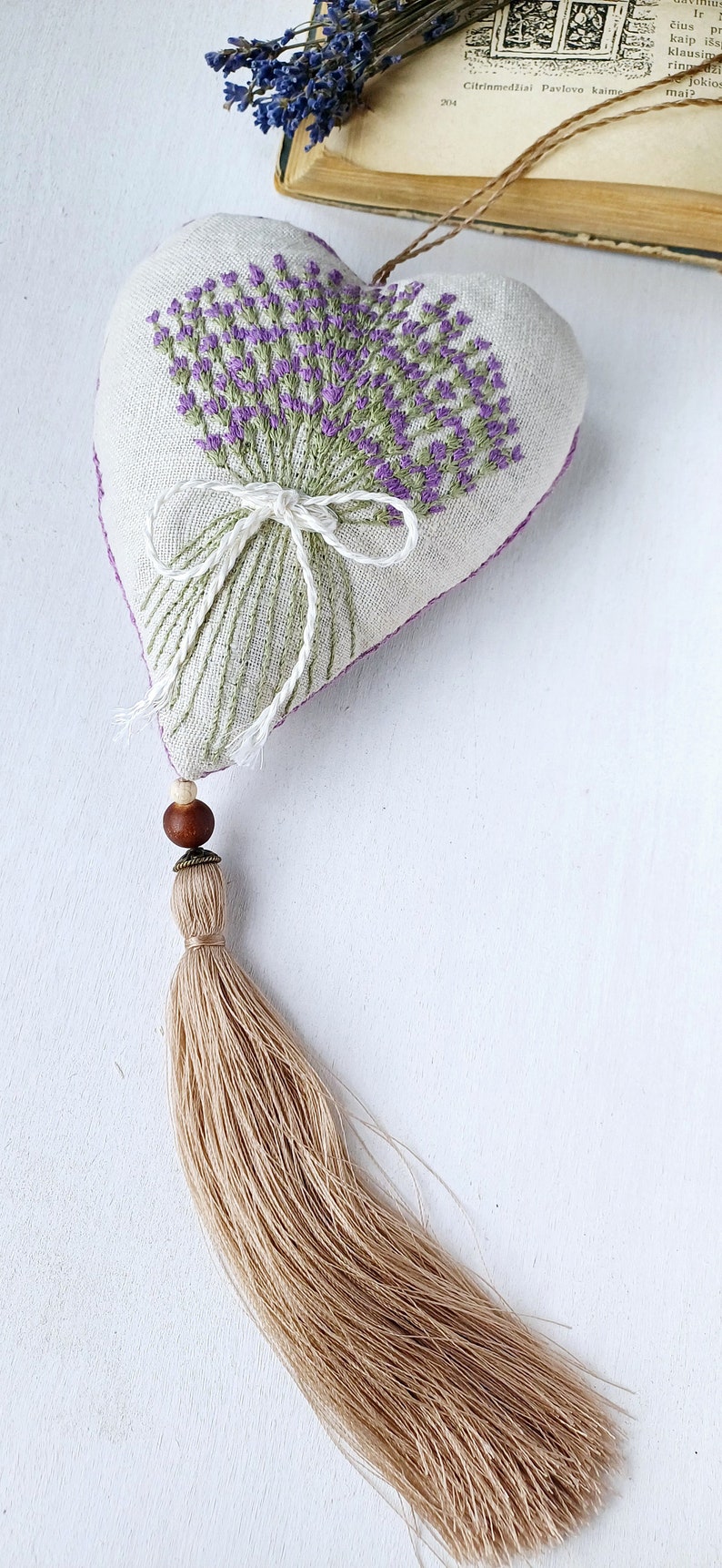 Handmade hand embroidered heart shaped linen sachet with hanging loop and tassel filled with lavender. Embroidered lavenders.