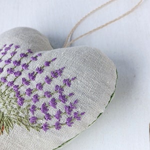 Linen handmade hand embroidered heart shaped sachet with tassel and hanging loop, filled with lavender. Finished embroidery. Embroidered pot with lavenders.