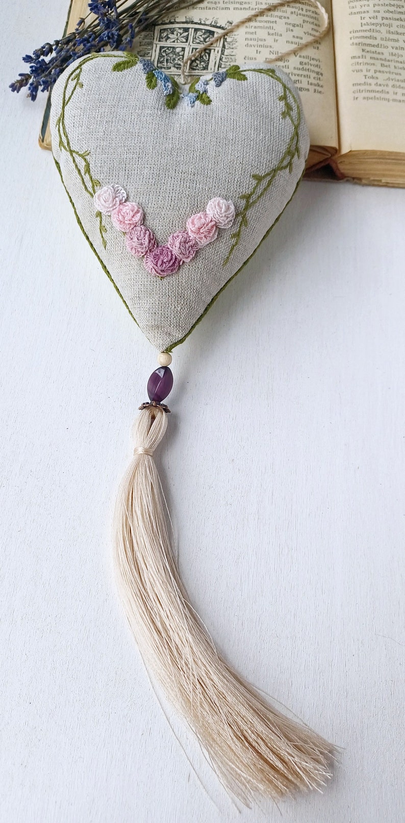 Hand embroidered linen sachet with tassel and hanging loop filled with lavender. Embroidered roses