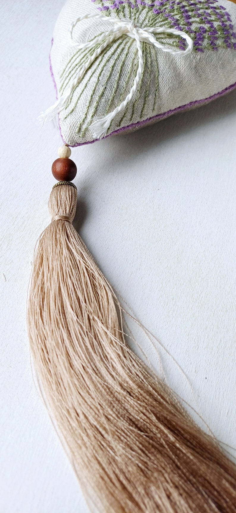 Handmade hand embroidered heart shaped linen sachet with hanging loop and tassel filled with lavender. Embroidered lavenders.