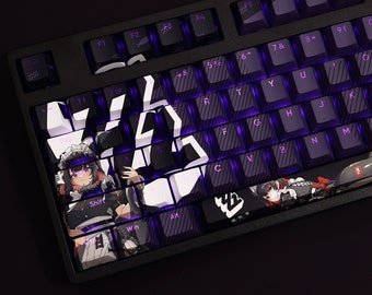 May include: A black mechanical keyboard with purple backlighting and custom keycaps featuring anime characters. The keycaps have a white and black geometric pattern.