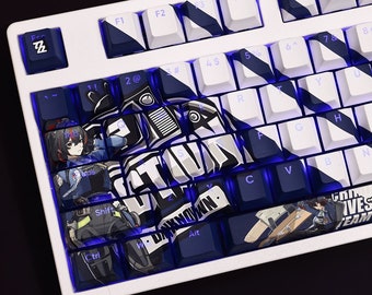 May include: A white mechanical keyboard with blue and black keycaps. The keycaps feature a graphic design with a cartoon character and the text "UNKNOWN".