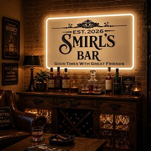 May include: A dimly lit bar area with a large illuminated sign that reads "SMIRL'S BAR" and "Good Times With Great Friends". The bar features a wooden cabinet with bottles, glasses, and a decanter. A leather armchair and a table with a glass of whiskey are in the foreground.