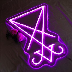 May include: A purple neon sign in the shape of a pentagram with a circle around it.