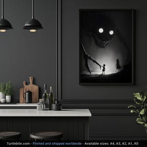 May include: Black and white framed art print depicting a nightmarish creature with glowing eyes looming over two small figures. The artwork has a dark, ominous theme, with a focus on shadows and contrast. The print is displayed in a modern kitchen setting.