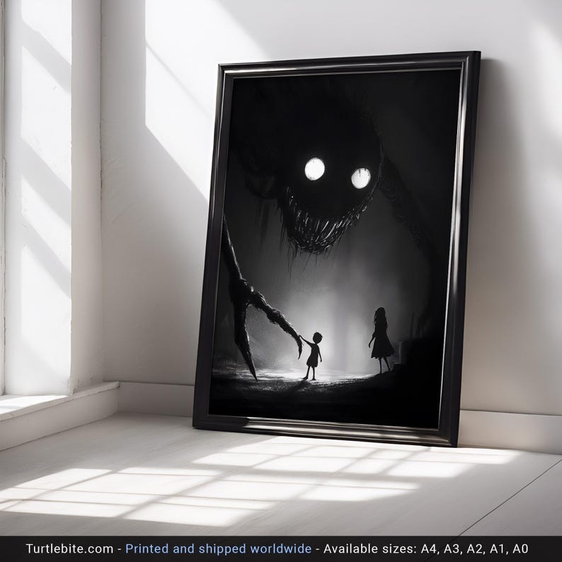 May include: Black and white framed art print depicting a nightmarish scene. A large, shadowy creature with glowing eyes looms over two small figures. The print is displayed against a white wall and floor, creating a stark contrast.