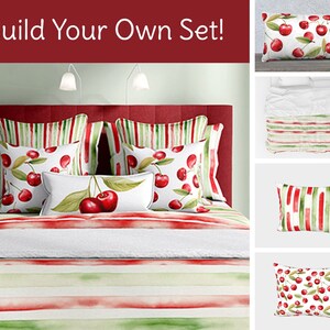May include: Build your own bedding set with a red and green watercolour stripe pattern and a cherry print. The set includes a duvet cover, pillowcases, and throw pillows.