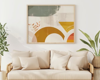 May include: A beige sofa with three cushions, a framed abstract art print featuring yellow, orange, and green colours, and a potted plant with green leaves. The sofa is made of wood and has a light brown finish.