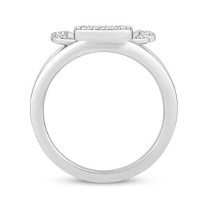 May include: A silver ring with a square-shaped center stone and two smaller stones on either side. The stones are set in a pave setting and are surrounded by a silver band.