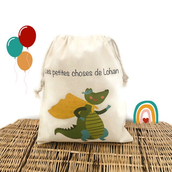 Sac pochon de rangement pour enfant, en coton, au prénom personnalisé Lohan et illustration Dinosaure, parfait pour emmener doudou partout !