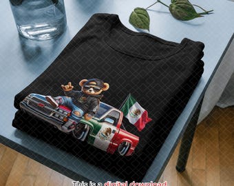 May include: A black t-shirt featuring a graphic of a teddy bear wearing sunglasses and a black hoodie, sitting on the hood of a lowered pickup truck painted with the colors of the Mexican flag and displaying a waving Mexican flag on the bed.