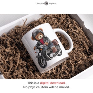 May include: White ceramic mug with a graphic of a teddy bear wearing a motorcycle helmet and leather jacket, riding a black motorcycle.