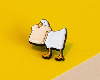 Toast-Thief Duck Enamel Pin - Charming Bread-Loving Duck Accessory for Casual Fun