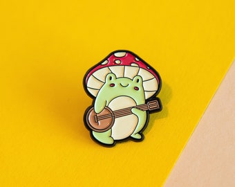 Cute Music Frog Enamel Pin - Quirky Amphibian Musician Folk Accessory for Strumming Along