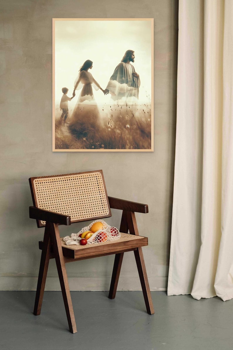 May include: A framed print depicts a family walking through a field, with a man and woman holding hands and a child following. A wooden chair with a woven seat holds a net bag of fruit. The scene is set against a neutral wall with a white curtain.