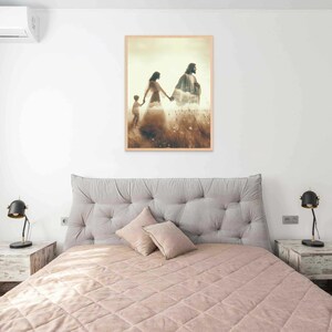 May include: A bedroom scene featuring a bed with a quilted pink comforter and a gray tufted headboard. Two matching nightstands flank the bed, each with a black lamp. A framed artwork depicting figures in a field hangs above the bed.