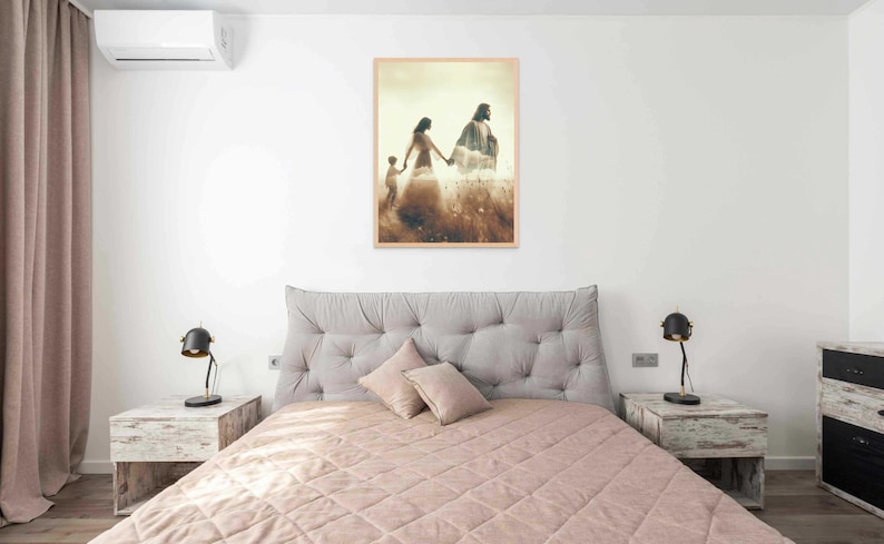 May include: A bedroom scene featuring a bed with a quilted pink comforter and a gray tufted headboard. Two matching nightstands flank the bed, each with a black lamp. A framed artwork depicting figures in a field hangs above the bed.