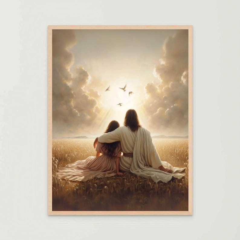 May include: A framed print depicts two figures seated in a field, embraced, with sunlight streaming through clouds above. The figures are draped in flowing robes, with birds flying in the sky. The artwork has a warm, golden color palette.