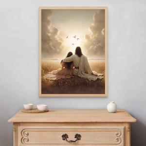 May include: A framed print depicts two figures seated in a field, bathed in sunlight. One figure has an arm around the other. Birds fly in the sky above. The artwork is in a wooden frame.