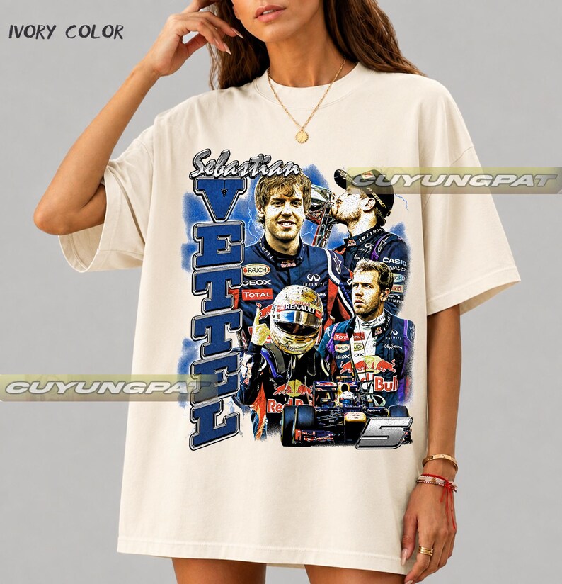 May include: An ivory-colored short-sleeve t-shirt featuring a graphic print of Formula 1 driver Sebastian Vettel. The design includes multiple images of the driver, a racing helmet, a race car, the text "Sebastian VETTEL", and the number 5.