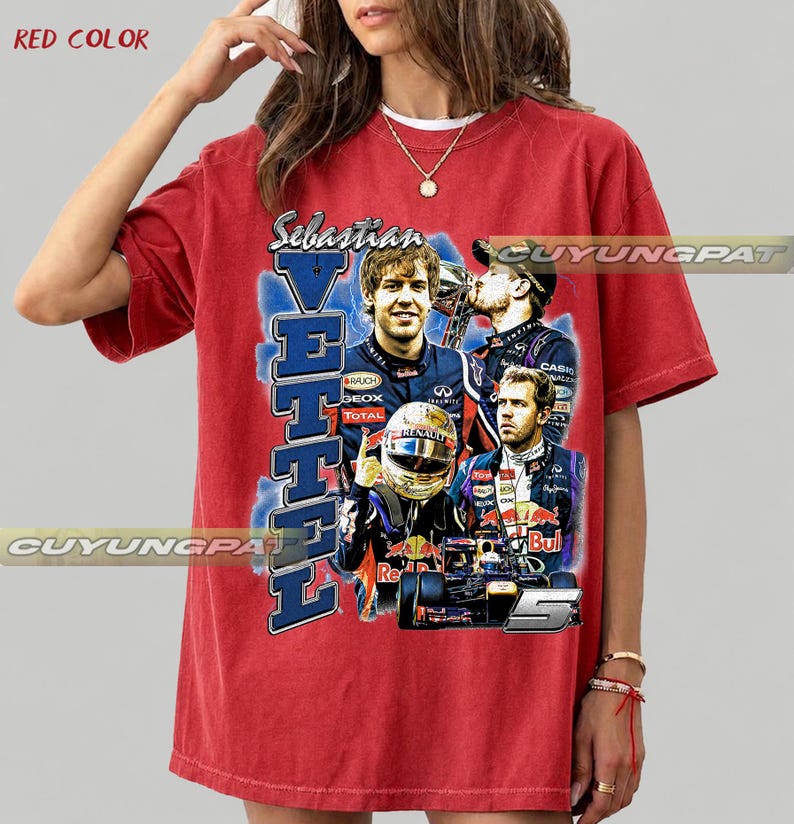 May include: A red short-sleeved t-shirt featuring a graphic print of Formula 1 driver Sebastian Vettel. The design includes multiple images of the driver, a racing helmet, a race car, the text Sebastian Vettel, and the number 5 in a blue background.