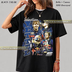 May include: A black oversized t-shirt featuring a graphic print of Formula 1 driver Sebastian Vettel. The design includes multiple images of the driver in racing gear, a helmet, a race car, the text "Sebastian VETTEL", and the number 5.