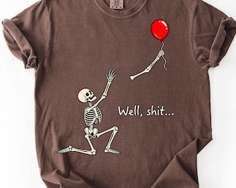 Grappig T-shirt met skelet en verloren ballon, T-shirt met comfortabele kleuren, Halloween skelet T-shirt, T-shirt met zwarte humor
