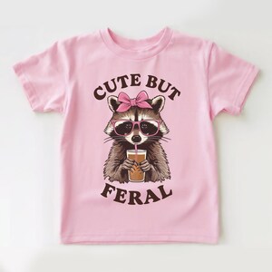 Cute But Feral Raccoon Toddler Shirt, Funny Raccoon Boy Girl Gift, Trash Dweller Animal Tee, Somebodys Feral Child, Natural Kids & Youth Tee
