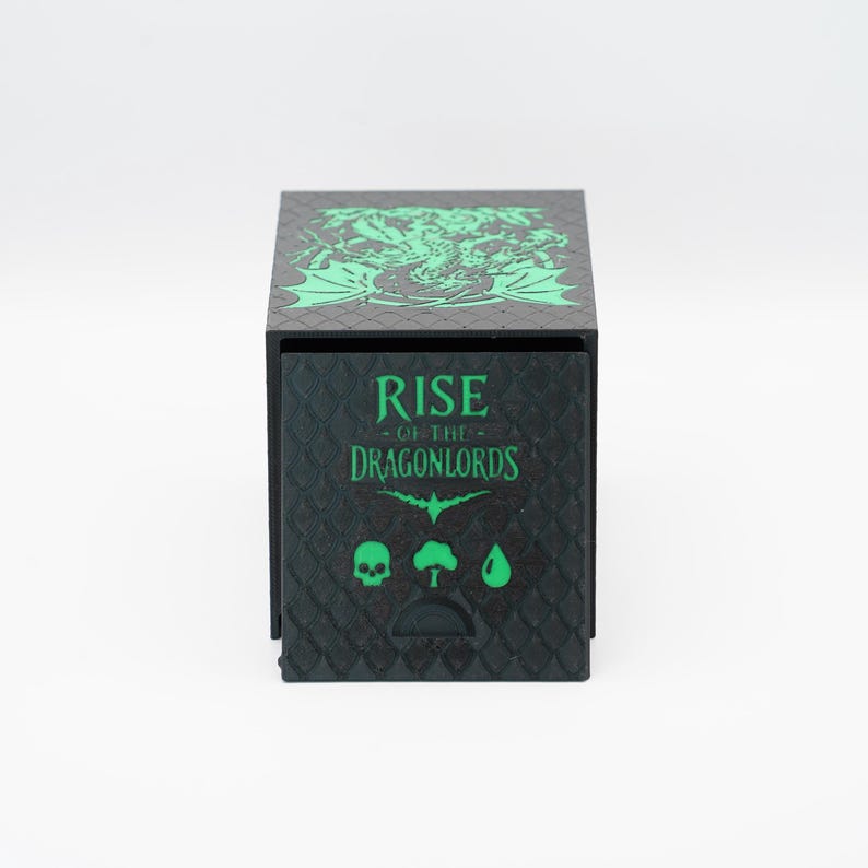 May include: Black box with green accents and the text "RISE OF THE DRAGONLORDS." The top of the box features a green dragon design. The front of the box has a skull, tree, and water drop symbol.