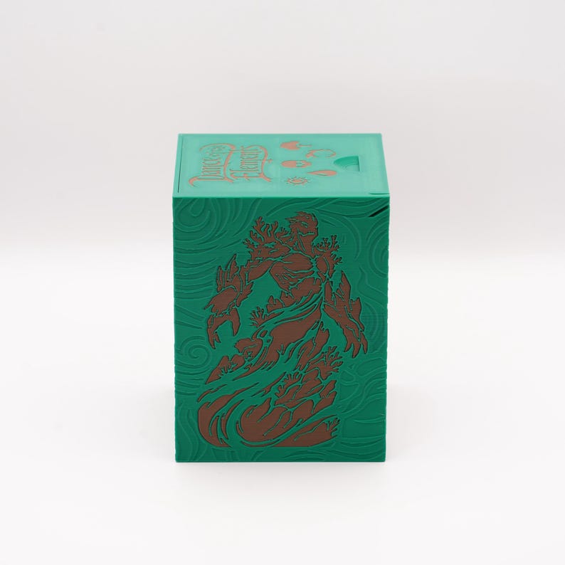 May include: A green box with a brown illustration of a figure on the front. The box has a textured surface with a swirling pattern. The top of the box has Chinese characters.