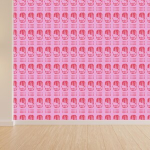 May include: Pink wallpaper featuring a repeating pattern of red hand symbols. The hands are depicted in a simple outline and are regularly spaced across the pink background. The design is modern and striking.