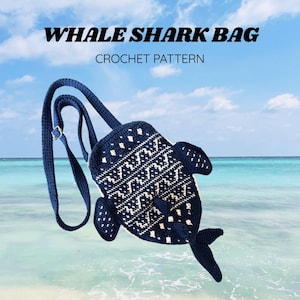 May include: A dark blue crochet bag shaped like a whale shark with white patterned details, a long adjustable strap, and a metal buckle. The text WHALE SHARK BAG CROCHET PATTERN is displayed above the bag, and jins.crochetory is at the bottom.
