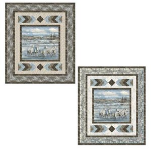 May include: Two square quilts depicting a landscape with white horses in water. The quilts have a central image framed by patterned borders in grey, blue, and beige. The design incorporates geometric shapes and a rustic aesthetic.