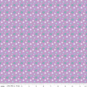 May include: A fabric with a repeating floral pattern. The flowers are in shades of white, teal, and lavender, set against a light purple background. The fabric is measured in inches, with the Riley Blake Designs logo visible.