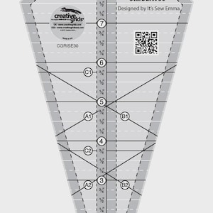 May include: A clear, diamond-shaped quilting ruler with black markings and measurements in inches. The ruler is labeled "Starburst 30°" and "Designed by It's Sew Emma." It features a Creative Grids logo and QR code.
