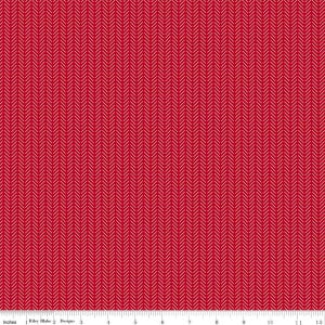 May include: Red fabric with a white herringbone pattern. The fabric has a ruler along the bottom edge, with the text "Inches" and "Riley Blake Designs". The pattern is a repeating series of diagonal lines.