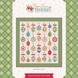 May include: A Christmas-themed quilt with a green border and a white background. The quilt features various colorful ornament designs. The text "Home Town Holiday" is at the top, and "Decorating the Tree" is at the bottom. Quilt size is 80.5" x 86.5".