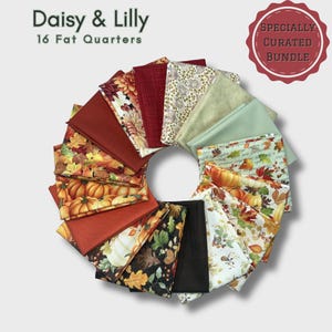 May include: A circular arrangement of sixteen fat quarters of fabric. The fabrics feature fall-themed patterns, including pumpkins, leaves, and floral designs, in shades of orange, red, and green. The text "Daisy & Lilly" and "16 Fat Quarters" is at the top. A red circular badge reads "Specially Curated Bundle."