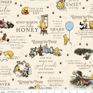 May include: A beige fabric featuring illustrations of Winnie the Pooh and friends, with quotes like "Kind words are like honey" and "Life was meant for good friends and grand adventures." The design includes bees and a blue balloon.