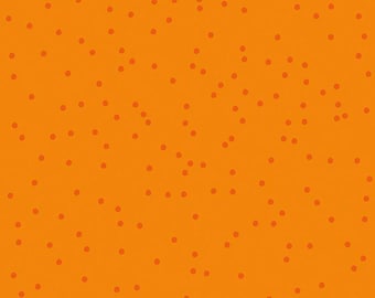 May include: Vibrant orange fabric featuring a random arrangement of small, darker orange dots. The fabric is measured in inches, with a ruler along the bottom edge. The text "Riley Blake Designs" is visible.