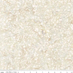 May include: A fabric swatch featuring a beige and tan terrazzo pattern with scattered white stone-like fragments. A ruler at the bottom edge shows a scale of 12 inches, with the text Riley Blake Designs printed clearly along the measurement line.
