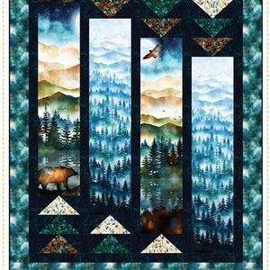 May include: A pieced quilt pattern titled "Ingots" with a forest landscape design. The quilt features a bear, trees, mountains, and a soaring bird. The color palette includes blues, greens, and browns. The text "A Confident Beginner Pieced Quilt" is displayed.