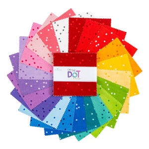 May include: A colorful assortment of fabric squares arranged in a circular pattern. Each square is a different color, including red, pink, purple, blue, green, and yellow, and features white polka dots. The center square is red with the text "ON THE DOT".
