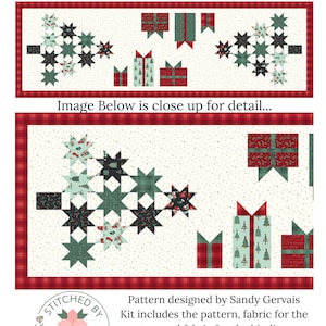 May include: A Christmas Ready Table Runner Kit with a finished size of 21" x 65". The design features two star-shaped trees and gift boxes in red, green, and cream fabrics with a red plaid border. Includes pattern, top fabric, and binding.