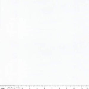 May include: A solid white fabric swatch featuring a subtle, tone-on-tone textured pattern. A black ruler is visible along the bottom edge, marked in inches from 1 to 12, with the text Riley Blake Designs printed near the one-inch mark.